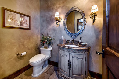 Inspiration for a mediterranean powder room remodel in San Francisco with an undermount sink