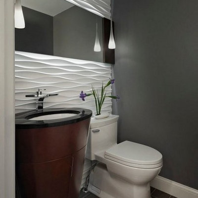 Powder room - small contemporary white tile and ceramic tile porcelain tile and gray floor powder room idea in San Francisco with gray walls, a one-piece toilet, dark wood cabinets, an undermount sink, granite countertops and black countertops