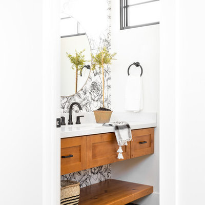 Powder room - small farmhouse porcelain tile and blue floor powder room idea in Salt Lake City with shaker cabinets, light wood cabinets, white walls, an undermount sink, marble countertops and white countertops