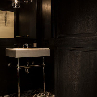 Powder room - mid-sized modern powder room idea in New York with a console sink