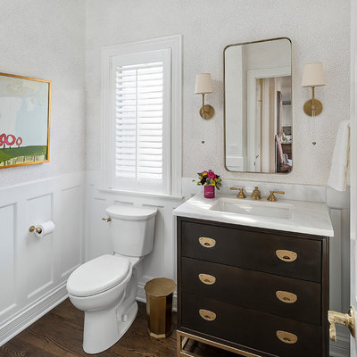 Powder room - small transitional brown floor and dark wood floor powder room idea in Chicago with flat-panel cabinets, dark wood cabinets, an undermount sink, marble countertops, a two-piece toilet and white walls