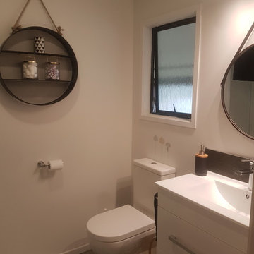 WC and vanity of renovated guest bathroom