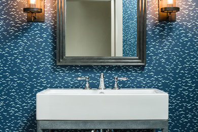 Urban dark wood floor powder room photo in Boston with blue walls, open cabinets and a vessel sink