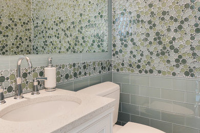 Example of a classic powder room design in Seattle with white countertops