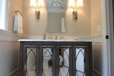 Example of a transitional powder room design in New York