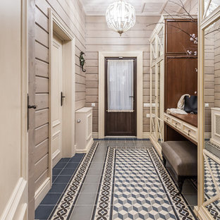 Réalisation d'une porte d'entrée champêtre en bois de taille moyenne avec un mur beige, un sol en carrelage de céramique, une porte simple, une porte en verre, un sol bleu et un plafond en lambris de bois.