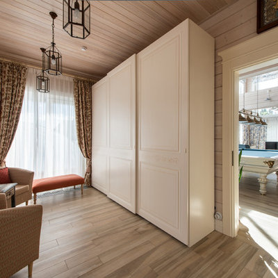 Inspiration for a country porcelain tile foyer remodel in Moscow with beige walls