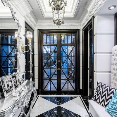 Example of a classic multicolored floor entryway design in Saint Petersburg with white walls and a glass front door