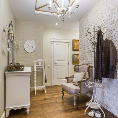 Elegant medium tone wood floor entryway photo in Moscow with beige walls