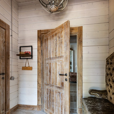 Example of a small farmhouse porcelain tile and beige floor entryway design in Saint Petersburg with beige walls and a medium wood front door