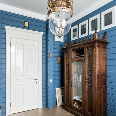 Farmhouse light wood floor and beige floor entryway photo in Moscow with blue walls