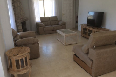 Example of a country marble floor family room design in Alicante-Costa Blanca