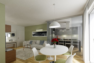Esempio di una piccola sala da pranzo aperta verso la cucina design con pareti verdi, parquet chiaro e pavimento giallo