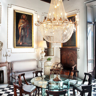 Immagine di una sala da pranzo chic con pareti bianche, camino classico, cornice del camino in pietra e pavimento multicolore