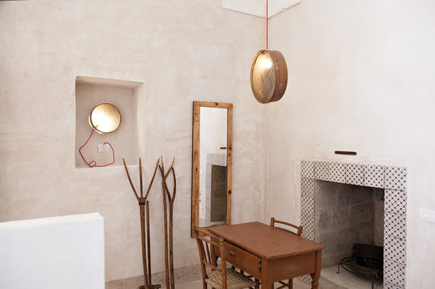 Mediterranean Dining Room by UZone Design