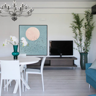 Ispirazione per una sala da pranzo aperta verso il soggiorno minimal di medie dimensioni con pareti bianche e pavimento grigio