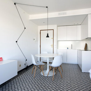 Immagine di una sala da pranzo aperta verso la cucina contemporanea con pareti bianche e pavimento multicolore