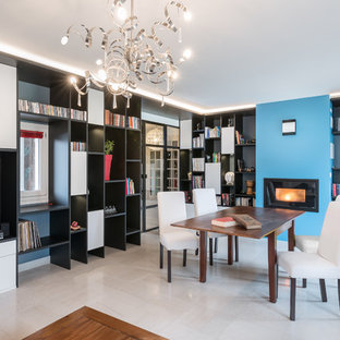 Idées déco pour une salle à manger ouverte sur le salon contemporaine avec un mur bleu et un sol blanc.