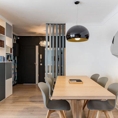 Great room - mid-sized contemporary light wood floor great room idea in Paris with white walls and no fireplace
