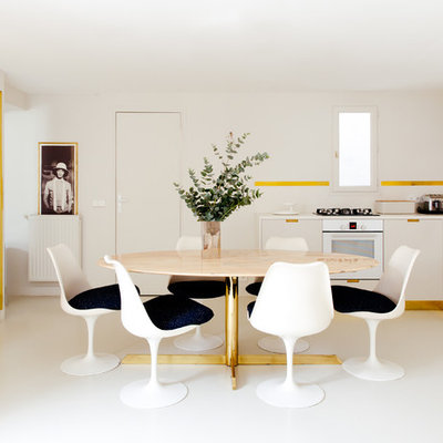 Example of a large trendy white floor kitchen/dining room combo design in Paris with white walls