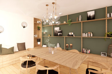 Idées déco pour une salle à manger contemporaine de taille moyenne avec une banquette d'angle, un mur vert et parquet clair.