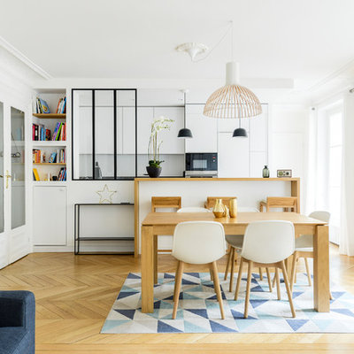 Great room - mid-sized contemporary light wood floor and brown floor great room idea in Paris with white walls, a standard fireplace and a stone fireplace