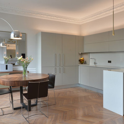 Inspiration for a large contemporary brown floor and light wood floor great room remodel in Paris with white walls