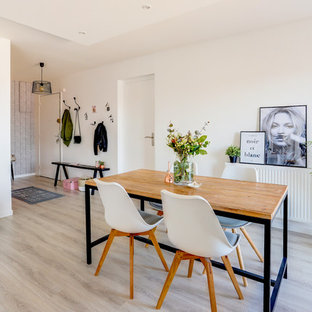 Inspiration pour une salle à manger nordique avec un mur blanc, sol en stratifié et un sol gris.