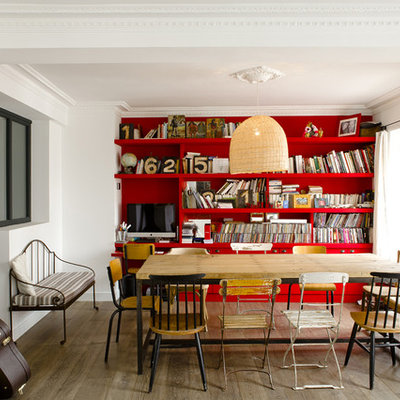 Example of a mid-sized trendy medium tone wood floor great room design in Paris with red walls
