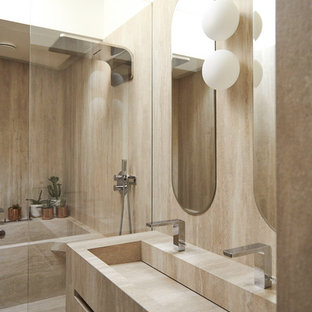 Mid-sized contemporary master wet room bathroom in Other with beige cabinets, beige tile, limestone, beige walls, limestone floors, limestone benchtops, beige floor, beige benchtops, flat-panel cabinets, an alcove tub and a trough sink.