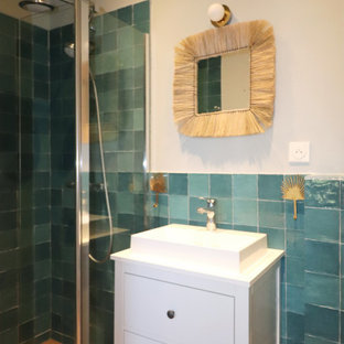 Inspiration for a small mediterranean 3/4 bathroom in Other with white cabinets, a curbless shower, green tile, ceramic tile, beige walls, laminate floors, a drop-in sink, beige floor, an enclosed toilet, a single vanity and a freestanding vanity.