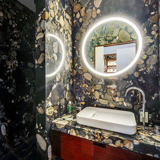 Inspiration pour une petit salle de bain design avec un placard à porte plane, un mur multicolore, une vasque et des portes de placard en bois sombre.