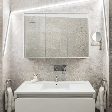 Une salle de bain contemporaine dans un appartement dans le XIV
