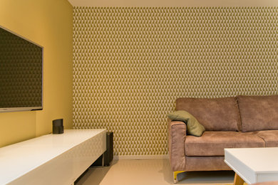 Inspiration pour une salle de séjour design avec un mur vert et sol en béton ciré.