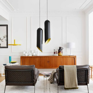 Foto de salón abierto, nórdico, sin chimenea y televisor, con paredes blancas y suelo de madera clara