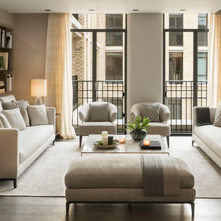 Inspiration for a contemporary living room in Palma de Mallorca with grey walls, dark hardwood flooring and brown floors.