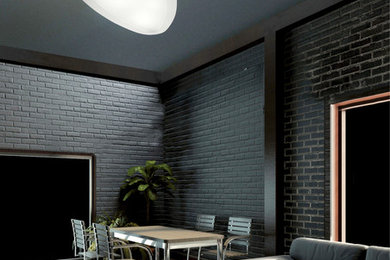 Diseño de salón contemporáneo con paredes negras, suelo de madera clara y televisor colgado en la pared
