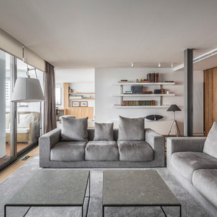 Foto de biblioteca en casa contemporánea, grande, sin chimenea, con paredes blancas