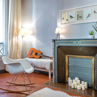 Idées déco pour un salon classique de taille moyenne et fermé avec un mur gris, un sol en carreau de terre cuite, une cheminée standard, un manteau de cheminée en pierre, aucun téléviseur et une salle de musique.
