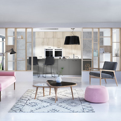 Large danish open concept concrete floor living room library photo in Nantes with gray walls and no tv