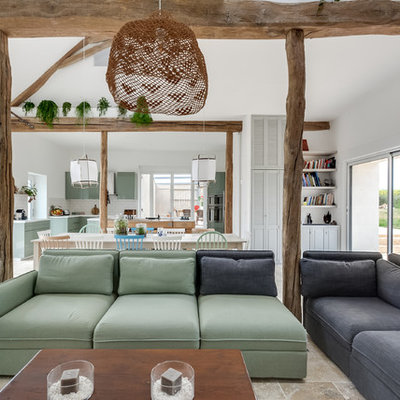 Large danish formal and open concept marble floor and beige floor living room photo in Paris with white walls, a wood stove and a tv stand