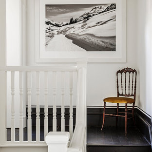 This is an example of a victorian wood wood railing staircase in London with wood risers.