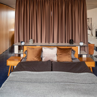 Diseño de dormitorio tipo loft, actual, grande, con paredes blancas y suelo azul