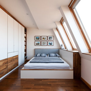 Medium sized contemporary bedroom in Other with white walls, medium hardwood flooring and no fireplace.