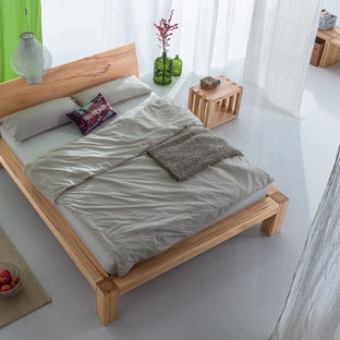 Diseño de dormitorio tipo loft, de estilo zen, grande, con paredes blancas, suelo de linóleo y suelo gris