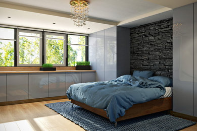 Diseño de habitación de invitados contemporánea de tamaño medio con paredes grises, suelo de madera clara, chimenea de esquina y marco de chimenea de madera