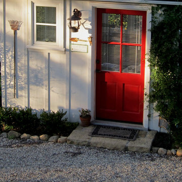 A Charming Red She Shed Front Door with Stone Landing Jeff Doubet Santa Barbara