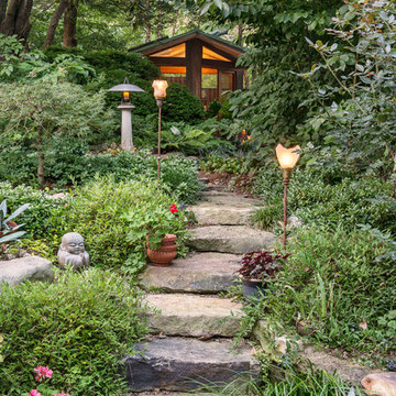 Boulder steps are lighted with custom candle lanterns