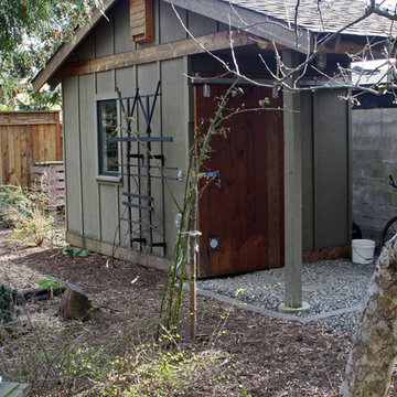 Detached shed featuring reused barn-style door from the RE Store