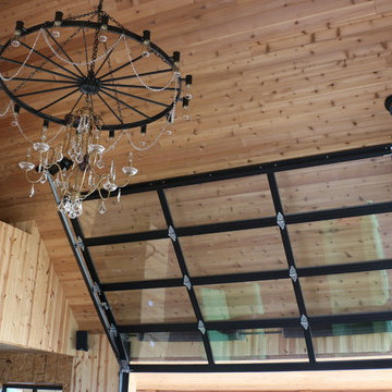 Entertainment room with overhead glass garage door